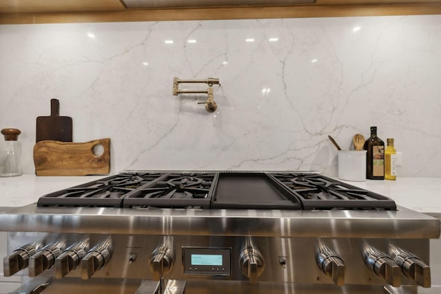 8901 Palmer Way, Brentwood, TN 37027 - kitchen view of stove, backsplash, and pot filler