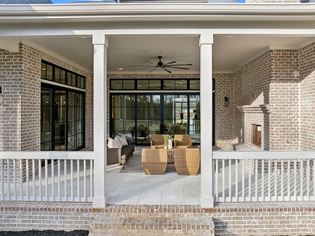 view of patio featuring ceiling fan