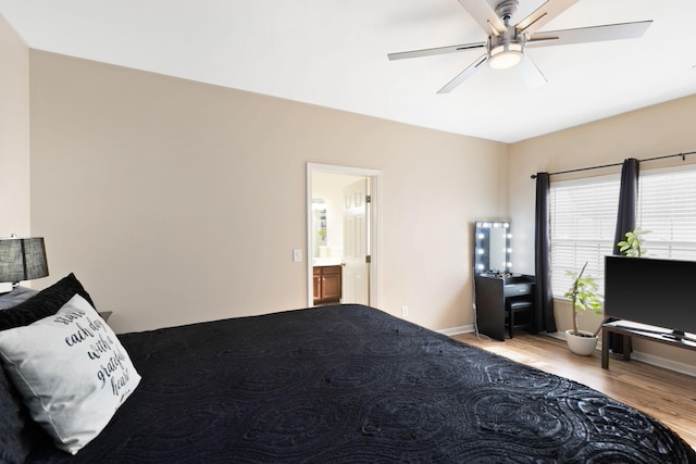 bedroom with ceiling fan, light hardwood / wood-style floors, and connected bathroom