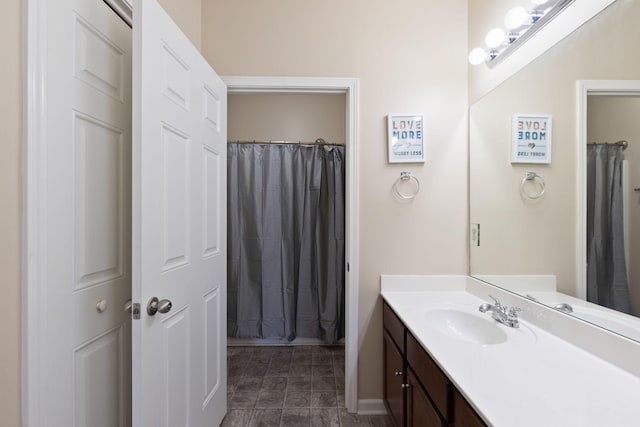 bathroom with a shower with curtain and vanity