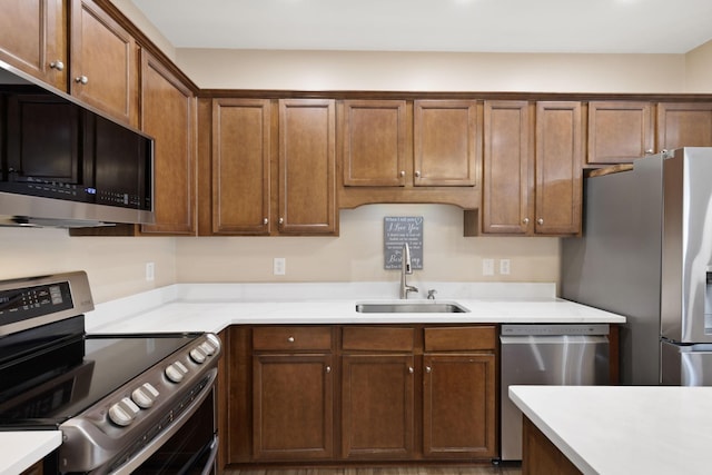 kitchen with appliances with stainless steel finishes and sink