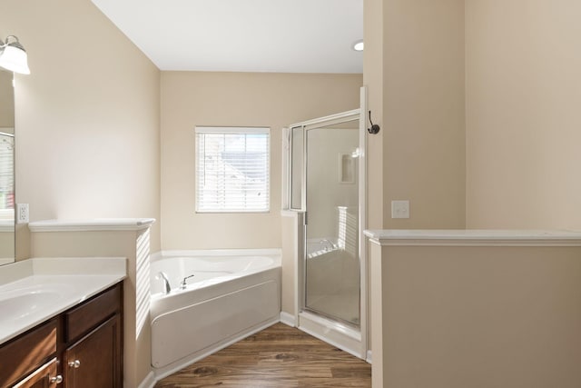 bathroom with vanity, shower with separate bathtub, and hardwood / wood-style flooring