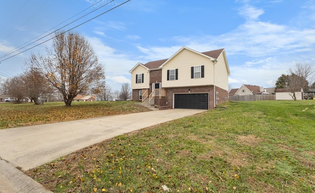 view of front of property with a garage and a front lawn