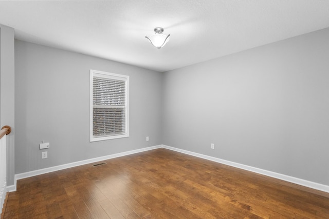 spare room with hardwood / wood-style flooring