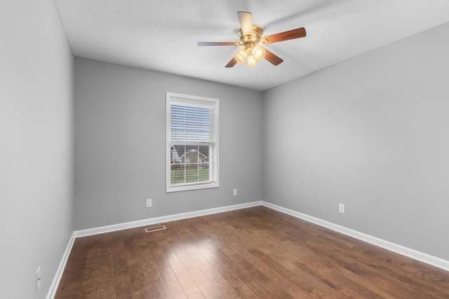 unfurnished room with ceiling fan and wood-type flooring