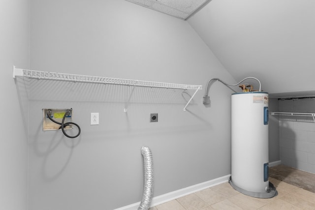 laundry room featuring electric dryer hookup, electric water heater, and light tile patterned flooring