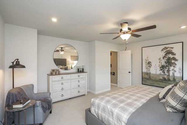 bedroom featuring ceiling fan and light colored carpet