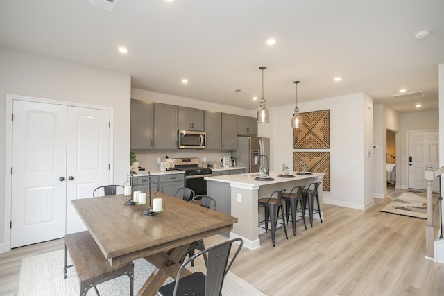 dining room featuring light hardwood / wood-style floors and sink