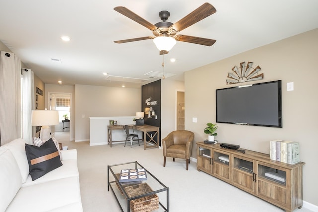 living room with light colored carpet and ceiling fan