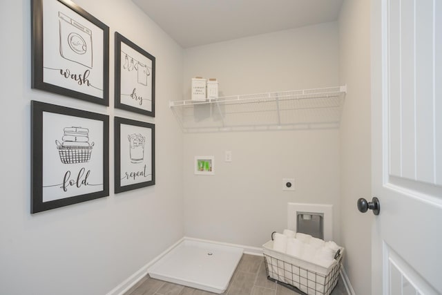 clothes washing area featuring hookup for an electric dryer, washer hookup, and hardwood / wood-style floors