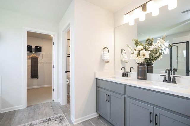 bathroom featuring vanity and walk in shower