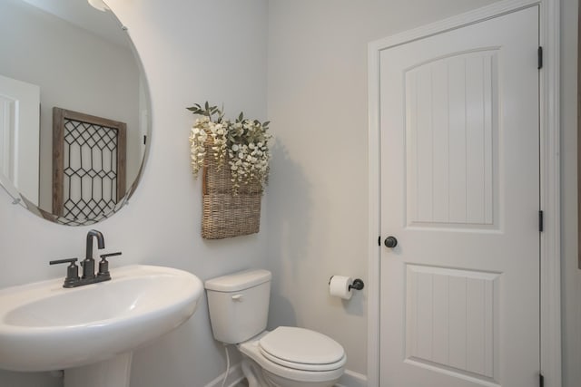 bathroom with toilet and sink