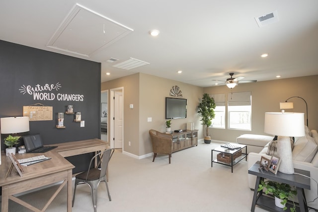 carpeted living room with ceiling fan