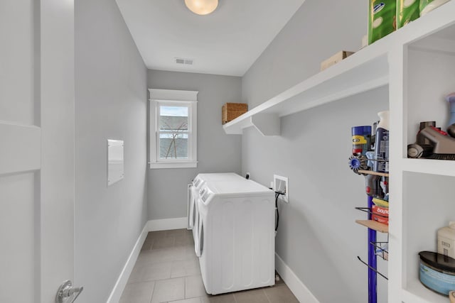 laundry room featuring independent washer and dryer and light tile patterned floors