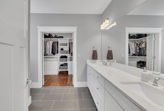 bathroom with tile patterned flooring and vanity