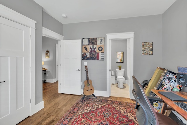 office with hardwood / wood-style flooring