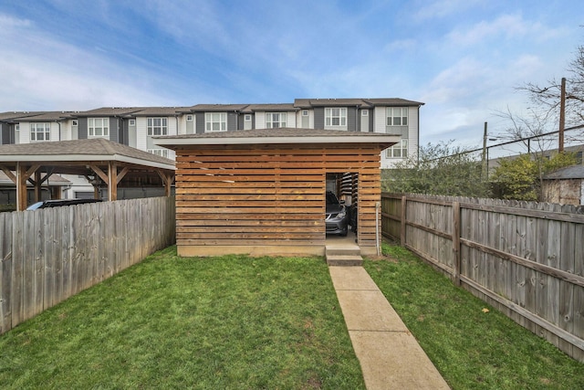 view of outbuilding featuring a lawn