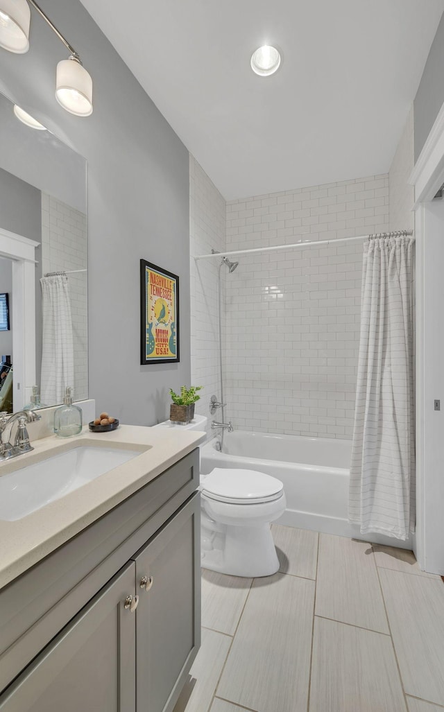 full bathroom with tile patterned floors, vanity, shower / bath combo, and toilet