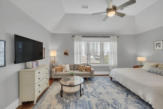 bedroom with wood-type flooring, ceiling fan, and lofted ceiling