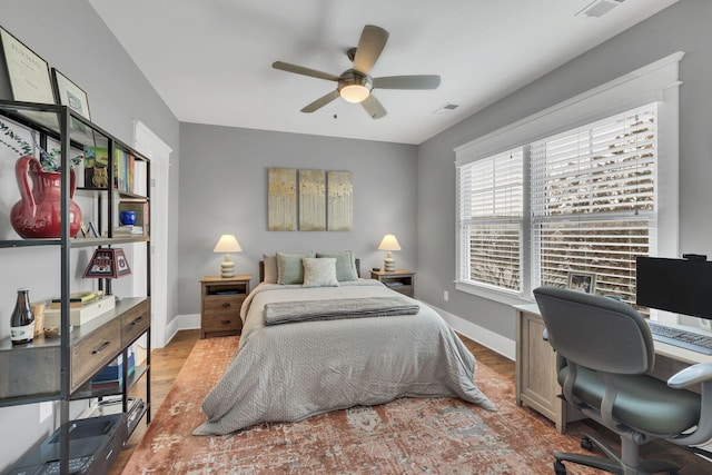 bedroom featuring ceiling fan and light hardwood / wood-style flooring