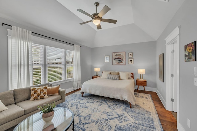 bedroom featuring hardwood / wood-style flooring, ceiling fan, and lofted ceiling