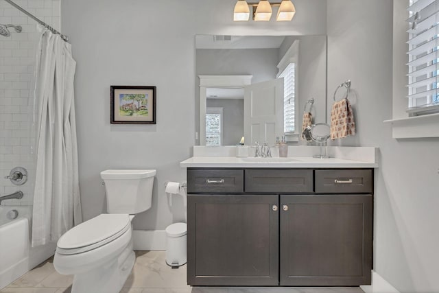 full bathroom with shower / tub combo with curtain, vanity, and toilet