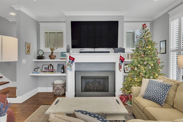 living room with dark hardwood / wood-style flooring and crown molding