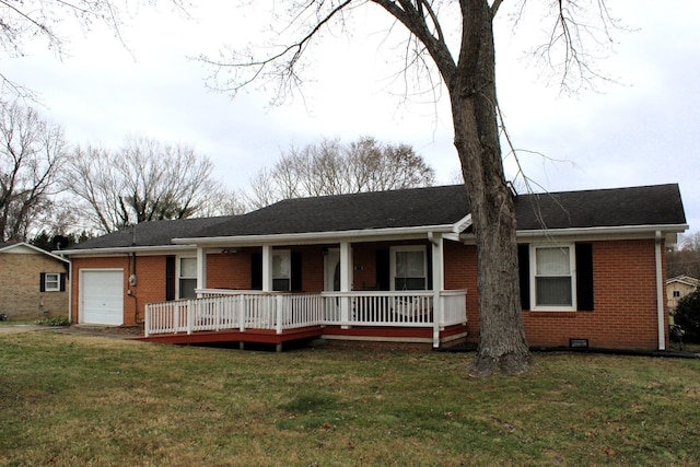 ranch-style home with a garage and a front lawn