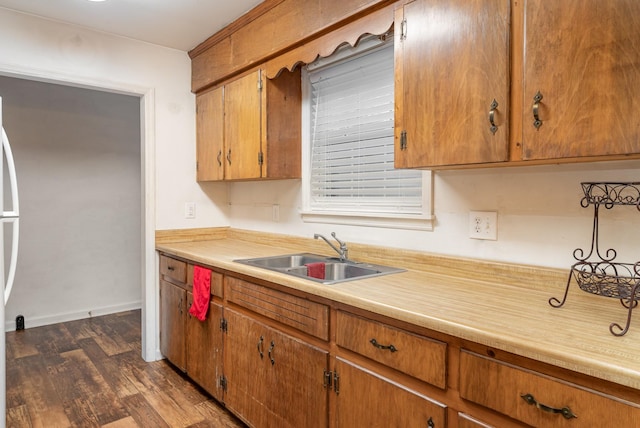 kitchen with dark wood-type flooring and sink