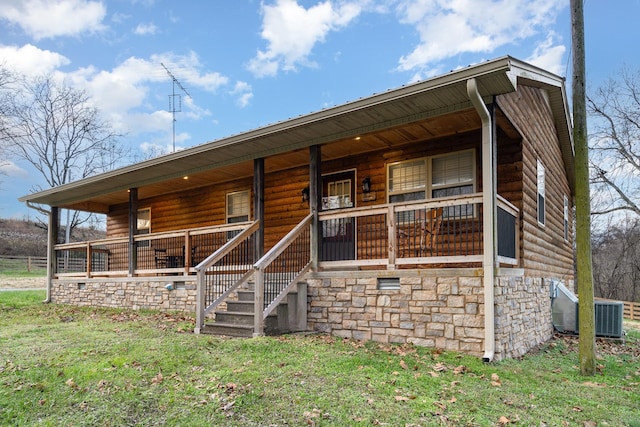 view of front of property featuring covered porch and cooling unit