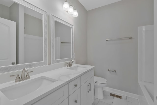 bathroom with toilet and vanity