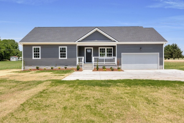 view of front facade with a front yard, a porch, and a garage