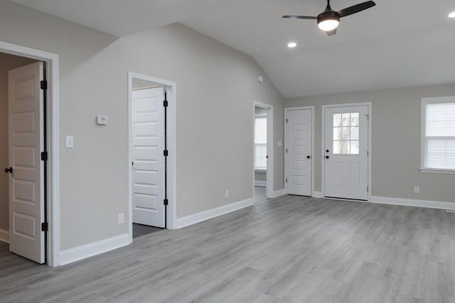 entryway featuring ceiling fan, light hardwood / wood-style flooring, and vaulted ceiling