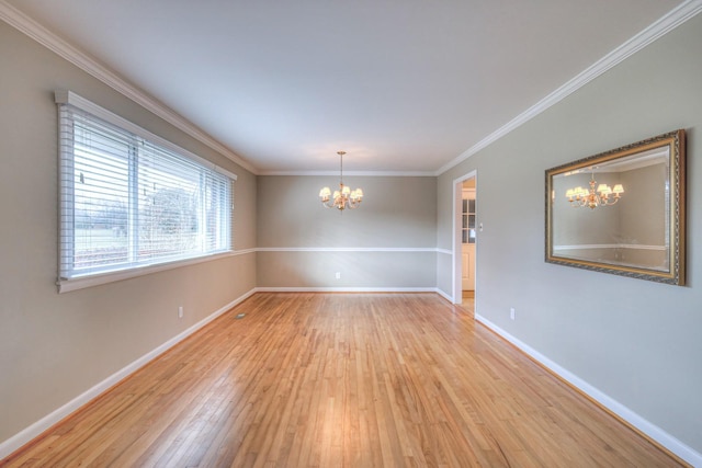 unfurnished room with a chandelier, light hardwood / wood-style floors, and crown molding