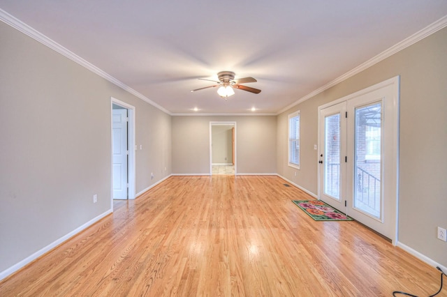 unfurnished room featuring ceiling fan, crown molding, and light hardwood / wood-style flooring