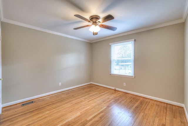 empty room with ceiling fan, light hardwood / wood-style floors, and crown molding