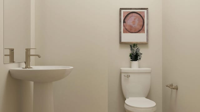 bathroom with sink and toilet