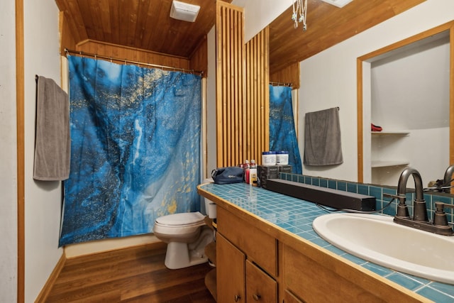 bathroom featuring wood ceiling, wood-type flooring, toilet, walk in shower, and vanity