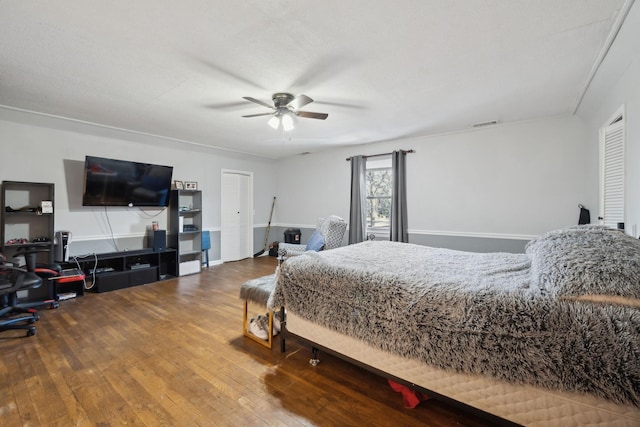 bedroom with hardwood / wood-style floors and ceiling fan