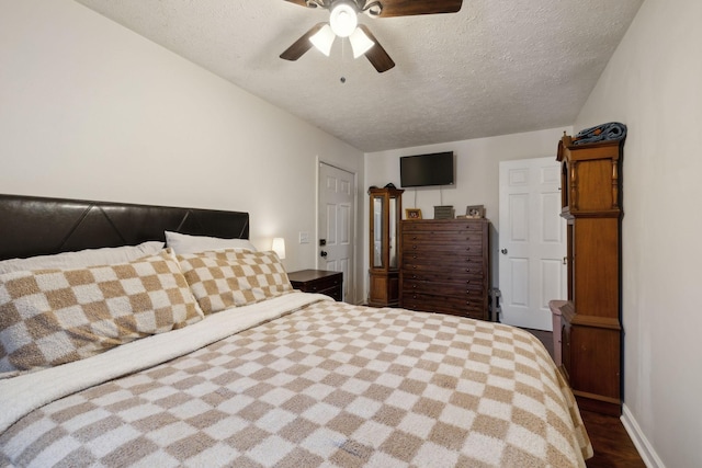 bedroom featuring ceiling fan, a textured ceiling, and hardwood / wood-style flooring