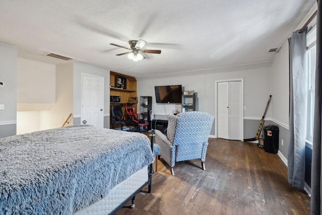 bedroom featuring ceiling fan and dark wood-type flooring