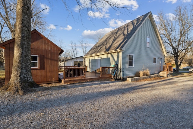 view of side of property with a deck