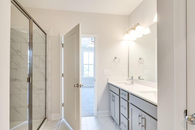 bathroom featuring ceiling fan, a shower with door, and vanity