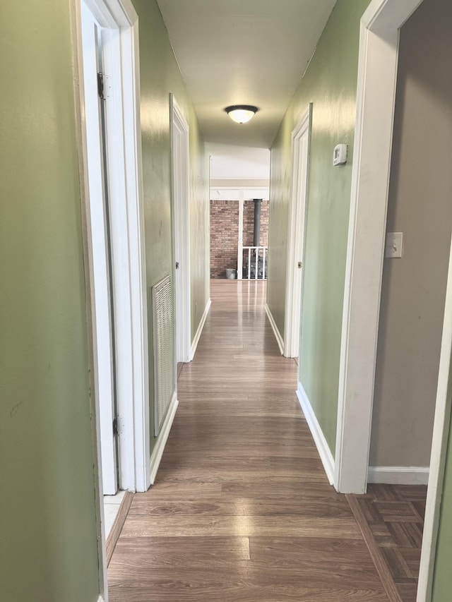 hall with dark hardwood / wood-style floors