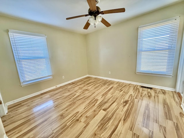 unfurnished room featuring ceiling fan and light hardwood / wood-style flooring