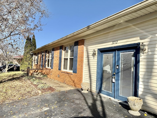 view of property exterior with french doors