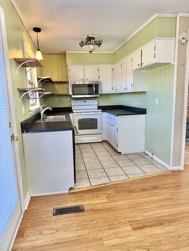 kitchen with white cabinetry, sink, light hardwood / wood-style flooring, and white electric range