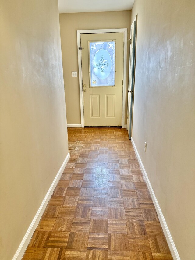 entryway with light parquet flooring