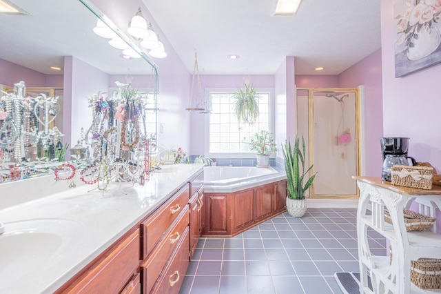 bathroom with tile patterned flooring, shower with separate bathtub, and vanity