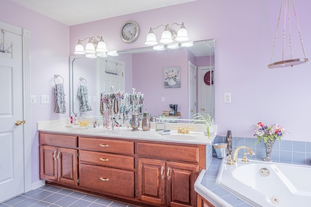 bathroom with tile patterned floors, vanity, and tiled bath